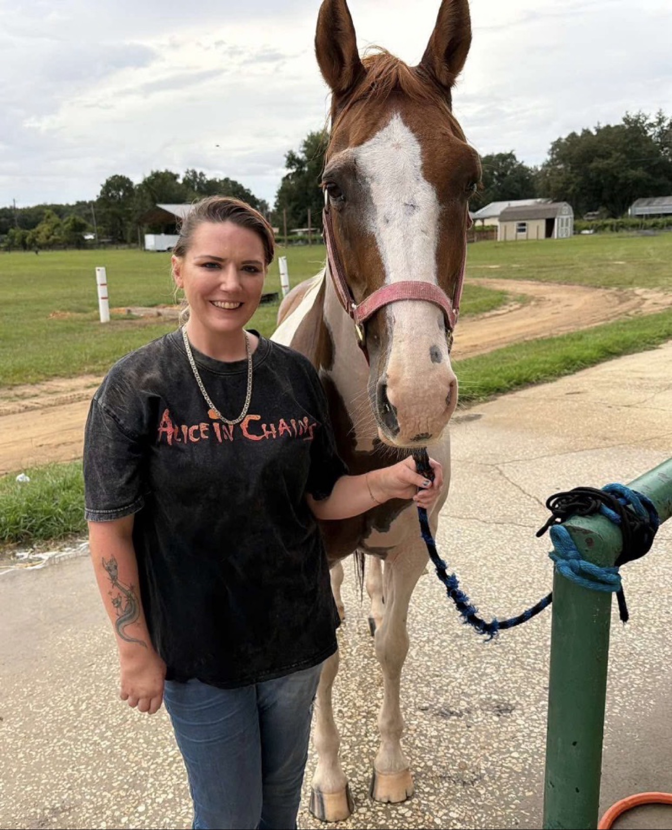 A Hayley Stables customer standing with her purchased paint horse