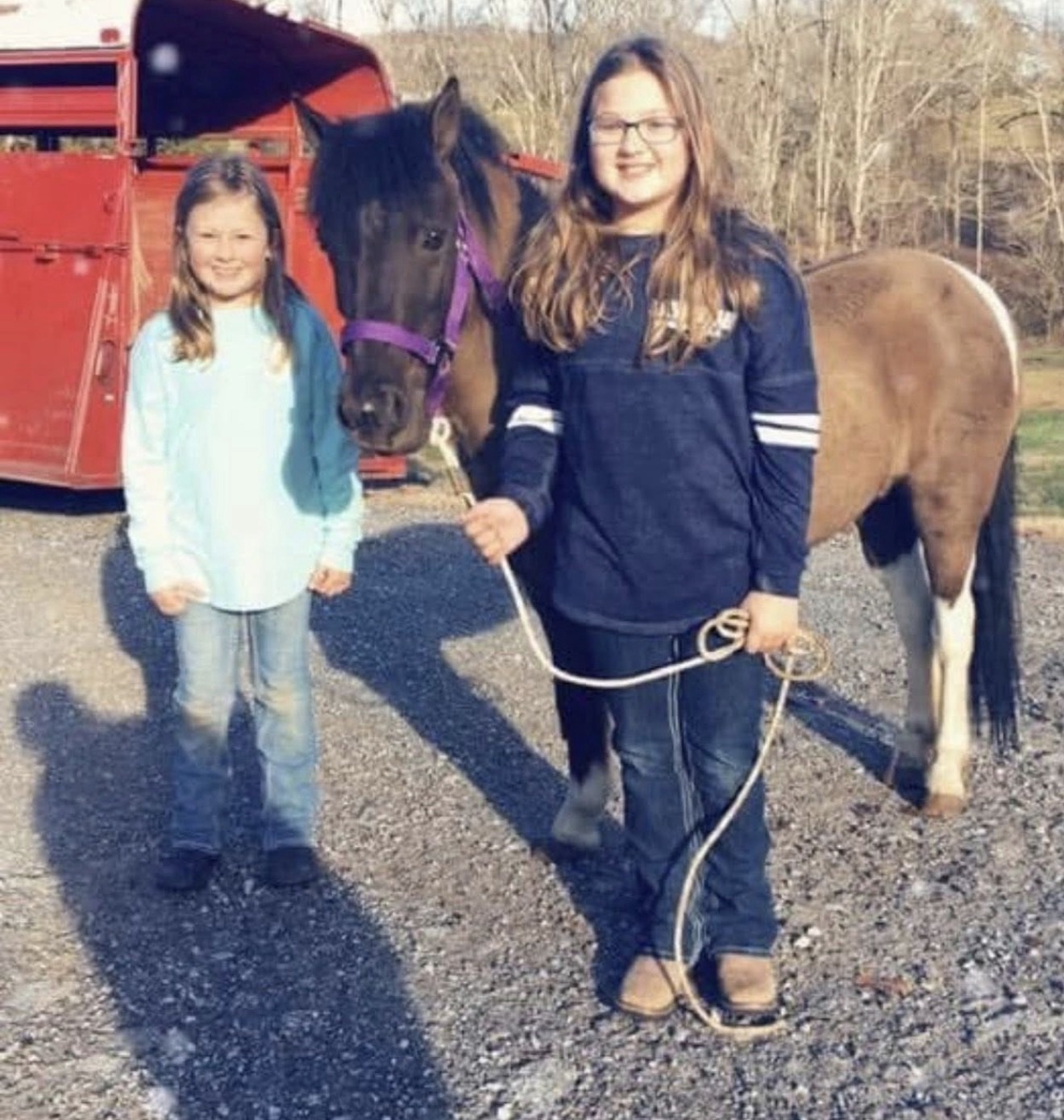 A Hayley Stables customer standing beside their horse