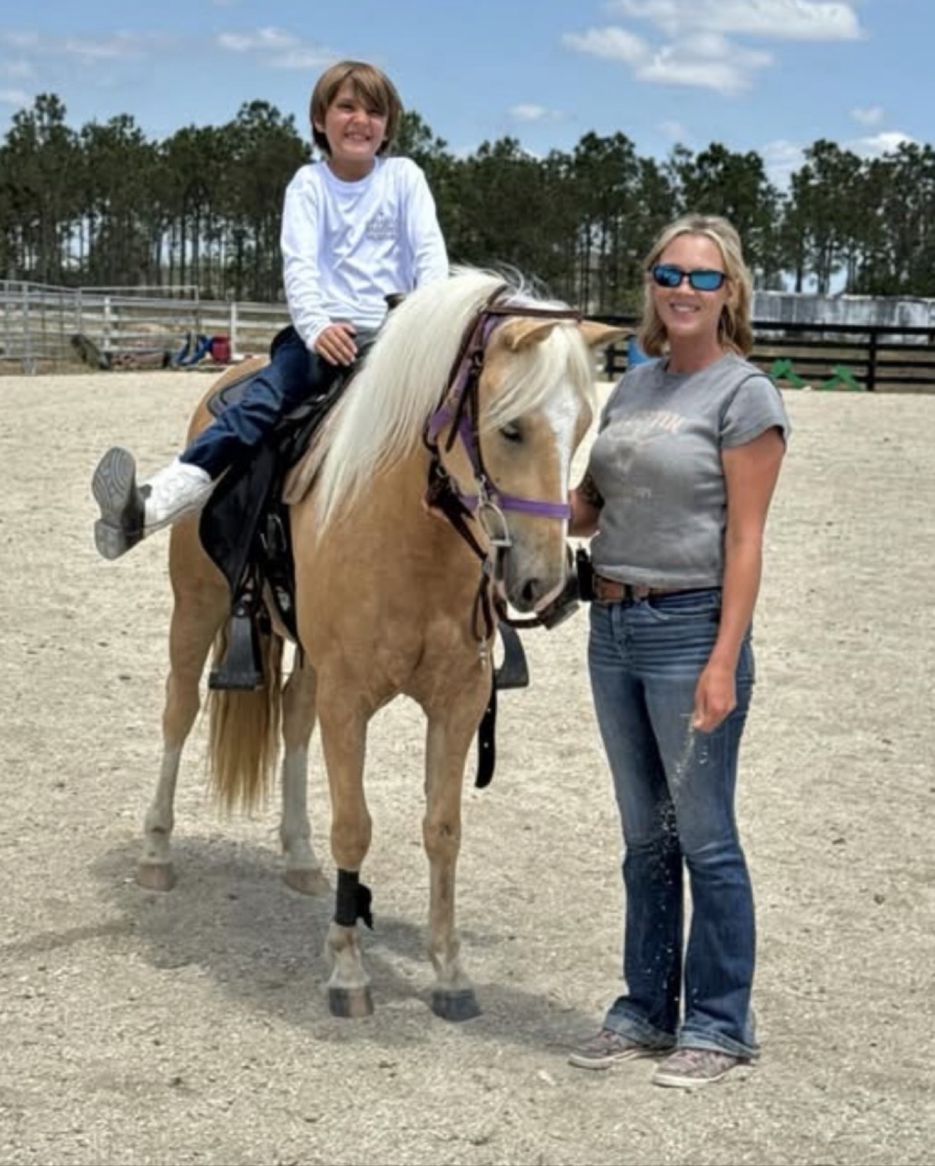 A Hayley Stables customer with her purchased palomino horse
