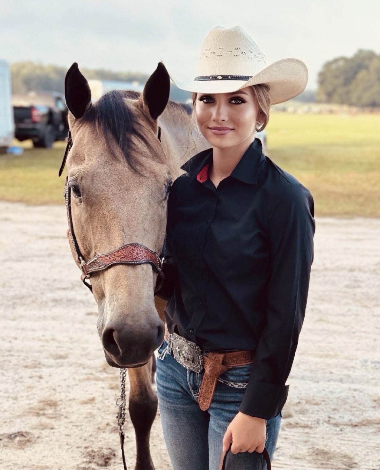 A Hayley Stables customer standing beside her purchased horse
